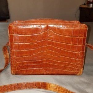 Vintage Carlos Falchi brown leather purse.